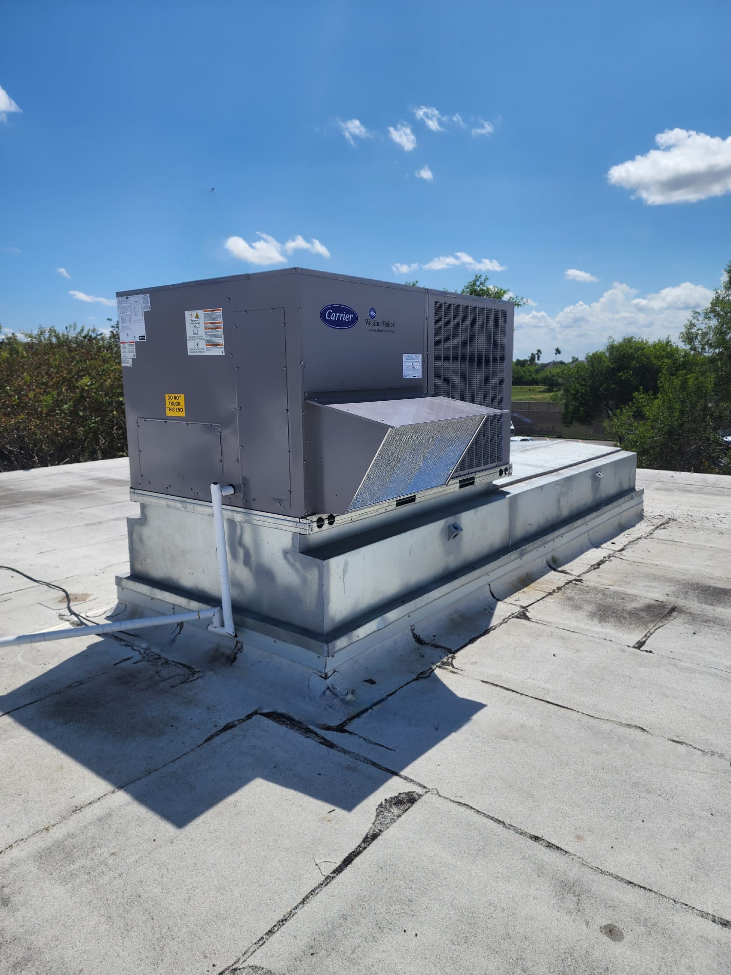 Carrier WeatherMaker rooftop package unit installed on a commercial roof