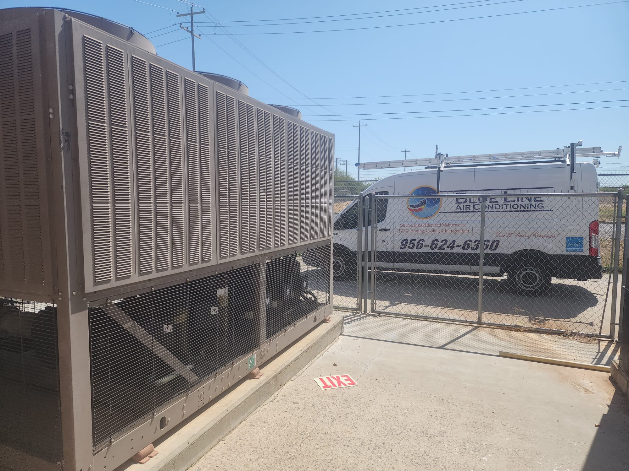 Commercial chiller serviced by Blue Line, company van on site